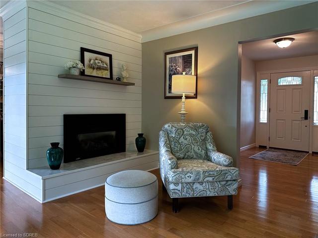 Shiplap designed gas fireplace in the living room. | Image 2