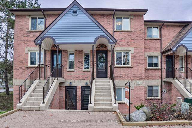 10 - 142 Ecclestone Dr W, Townhouse with 2 bedrooms, 2 bathrooms and 1 parking in Bracebridge ON | Image 1