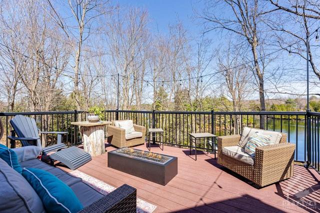 Trex deck has propane firepit-fireplace and overlooks lake | Image 17