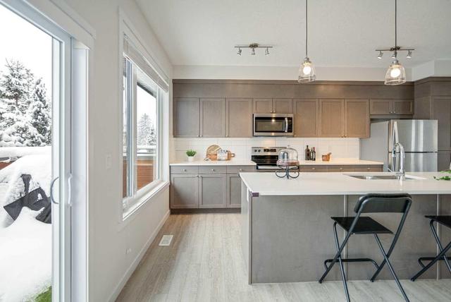 129 Shawnee Common Sw, Home with 3 bedrooms, 2 bathrooms and 2 parking in Calgary AB | Image 10