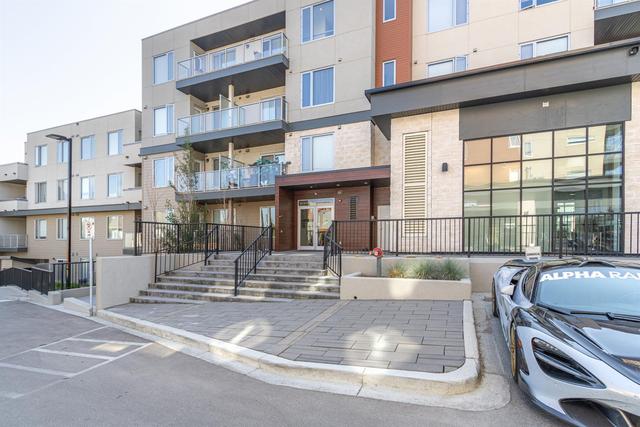208 - 30 Shawnee Common Sw, Condo with 2 bedrooms, 2 bathrooms and 1 parking in Calgary AB | Image 1