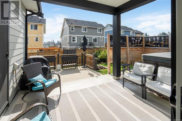 covered patio space with access to hot tub | Image 22
