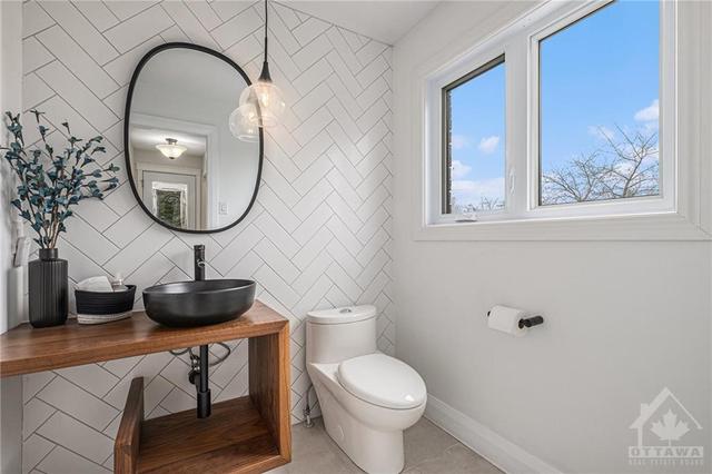 Custom powder room located off of butler pantry completed 2022. | Image 10
