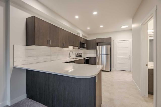 410 - 55 Wolf Hollow Crescent Se, Condo with 1 bedrooms, 1 bathrooms and 1 parking in Calgary AB | Image 3