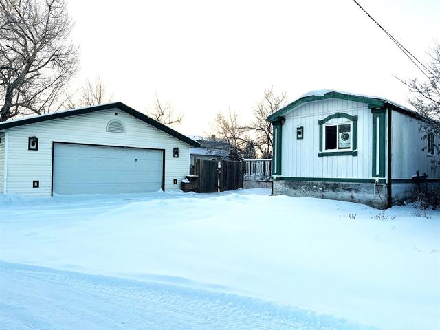 4409 50 Street, House detached with 3 bedrooms, 2 bathrooms and 6 parking in Saddle Hills County AB | Image 2