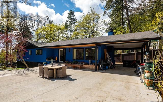 Expansive patio & outdoor space on this beautiful .39acre property. | Image 2