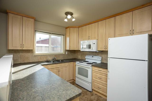 902 - 3907 39 Street, Home with 4 bedrooms, 1 bathrooms and 2 parking in Red Deer AB | Image 2