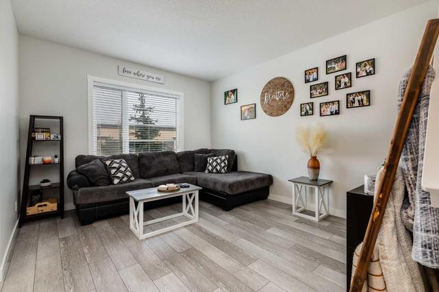30 Midtown Boulevard Sw, Home with 3 bedrooms, 2 bathrooms and 2 parking in Airdrie AB | Image 3