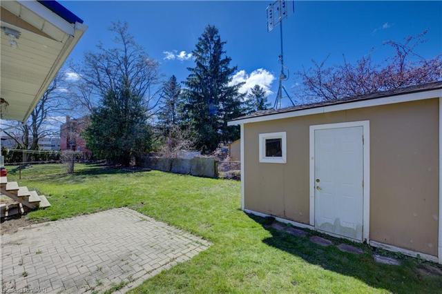 Situated on a pie-shaped lot in a family-friendly neighbourhood, this sidewalk-free home features a deep driveway with ample parking for 3+ vehicles and a good-sized storage building, adding convenience and practicality. | Image 17