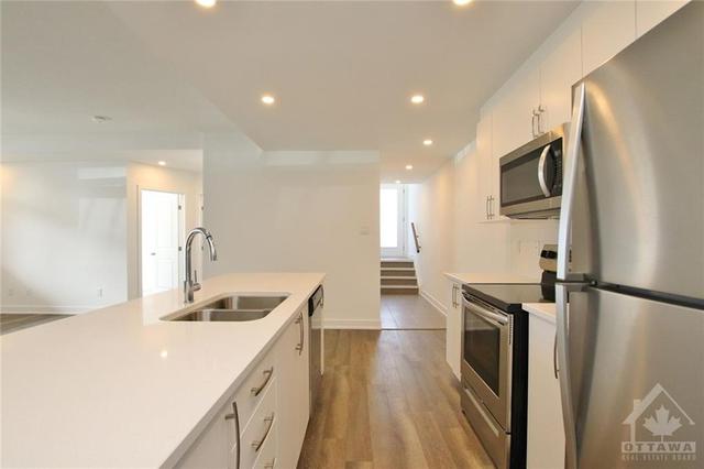 c - 310 Tulum Crescent, House attached with 2 bedrooms, 2 bathrooms and 1 parking in Ottawa ON | Image 7