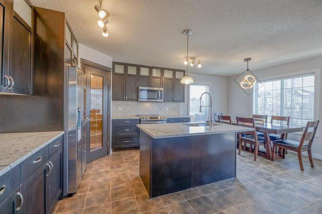 122 Channelside Cove Sw, House detached with 7 bedrooms, 3 bathrooms and 4 parking in Calgary AB | Image 7