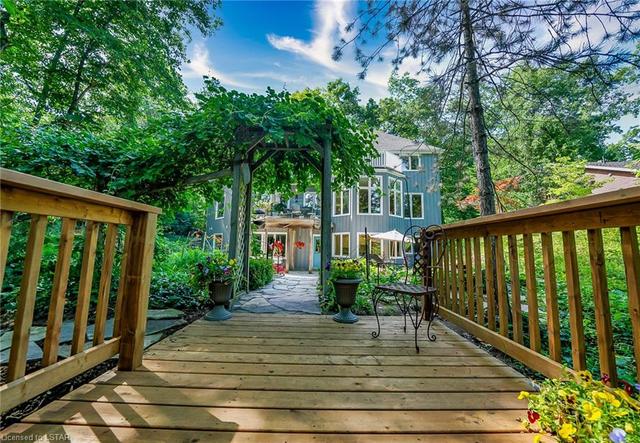 Kitchen overlooks river and beautiful gardens, and has easy access to formal dining, the breakfast nook and a deck overlooking the river | Image 6