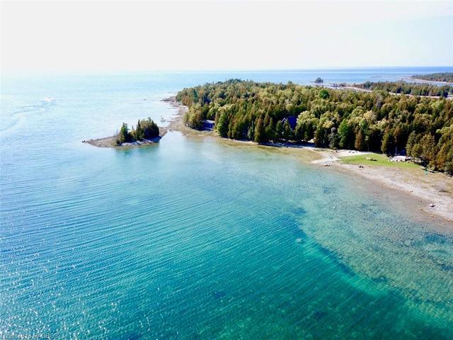 Located within a protected crystal clear bay with full views and access to open water Lake Huron. | Image 34