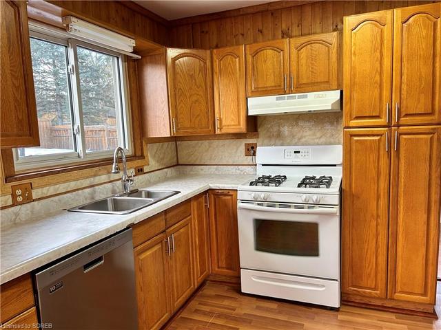 double sinks, lots of daylight and gas stove, pantry | Image 2