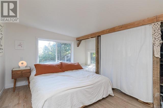 Large primary bedroom is your personal sanctuary, with large windows allowing for tons of natural light | Image 18