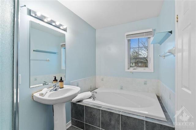 2nd level- Main bath with tons of storage above toilet and below sink. | Image 20
