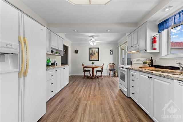 Spacious kitchen... you could have a dance in here lol - Patio doors on the right leading to the back deck and private backyard | Image 10
