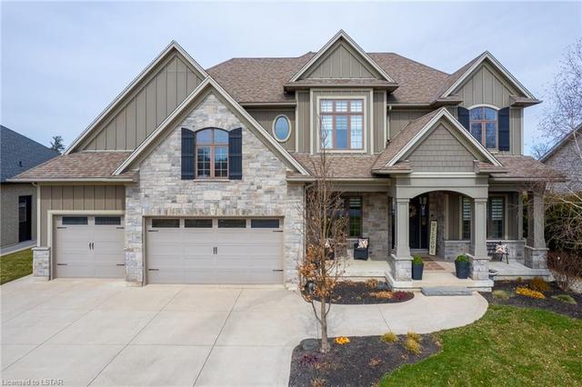 As you drive up, notice the elegant, timeless curb appeal with a mix of stone, craftsman style columns, James Hardie board, cedar and brick. | Image 12
