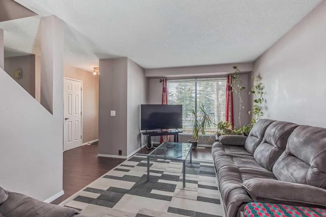 40 Falconridge Close Ne, Home with 3 bedrooms, 1 bathrooms and 2 parking in Calgary AB | Image 4