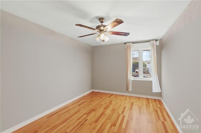 (Virtually Altered)  Main Floor 2 Bedroom Apt- Bedroom with ceiling fan & closet. | Image 10