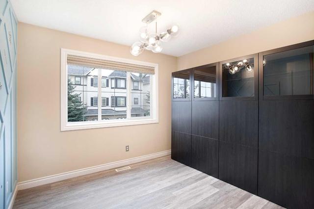 71 Cougar Ridge Mews Sw, Home with 2 bedrooms, 1 bathrooms and 2 parking in Calgary AB | Image 13
