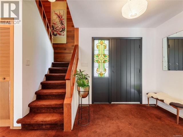 entry door with stairs leading to the upper level | Image 13