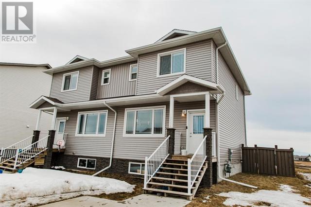 12654 103b Street, House semidetached with 3 bedrooms, 2 bathrooms and 2 parking in Grande Prairie AB | Card Image