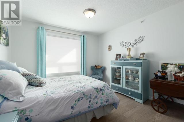 408, - 128 Centre Avenue, Condo with 2 bedrooms, 2 bathrooms and 1 parking in Cochrane AB | Image 24