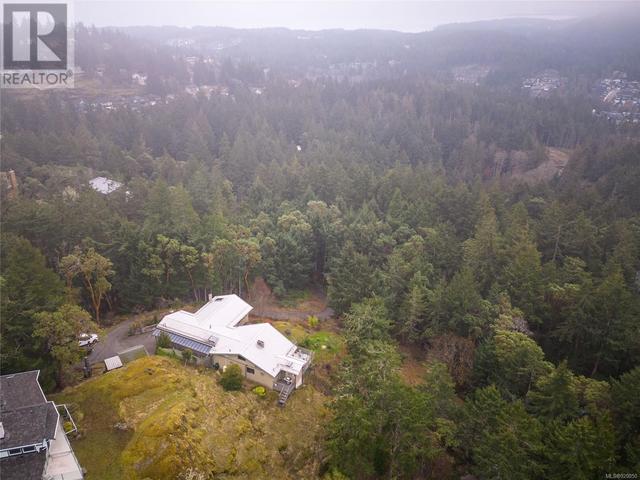 Perched on the high point of the 2.2 acre property facing south. over the straits. | Image 27