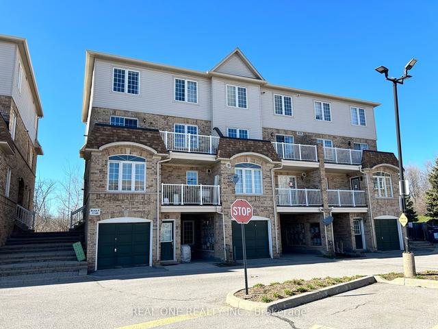 77 - 200 Mclevin Ave, Townhouse with 3 bedrooms, 2 bathrooms and 1 parking in Toronto ON | Image 1