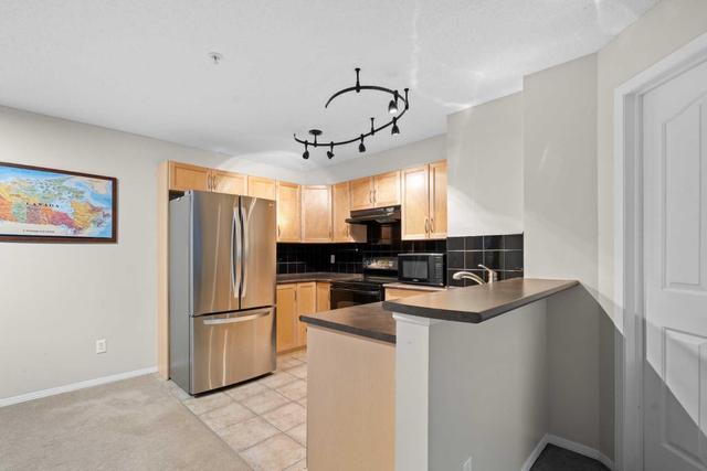 1124 - 60 Panatella Street Nw, Condo with 2 bedrooms, 2 bathrooms and 1 parking in Calgary AB | Image 4