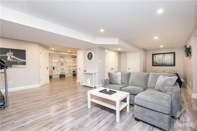 The impressive fully finished lower level is elegantly renovated with modern touches including pot lights. | Image 17