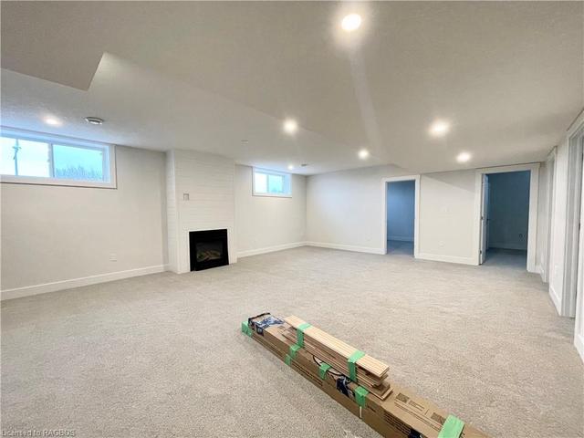 Finished basement family room with gas fireplace | Image 7