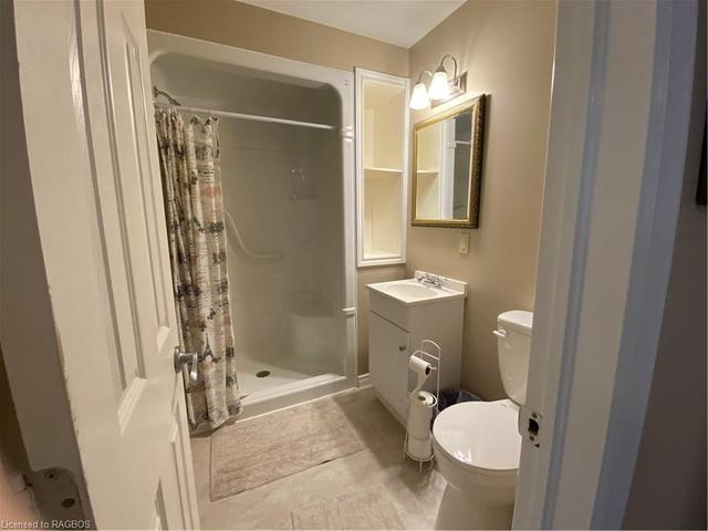 4 pc. bath main level (there is also a 3 pc. bath on main level).Flooring is vinyl tile. | Image 11