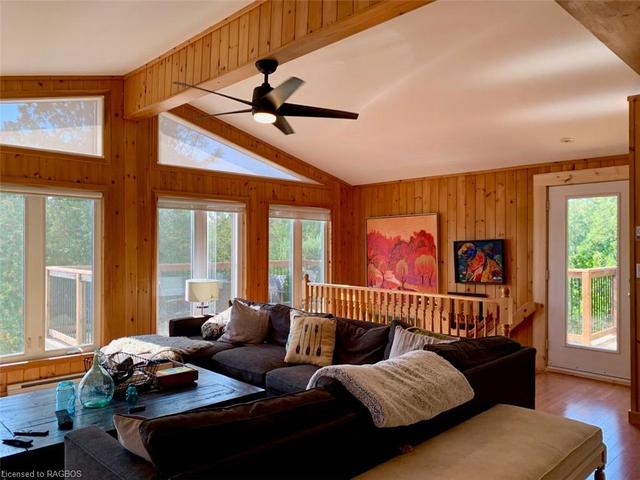 Vaulted ceilings and walkout to brand new wrap-around elevated deck. | Image 48