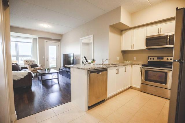 403 - 630 Sauve St, Condo with 2 bedrooms, 2 bathrooms and 1 parking in Milton ON | Image 2