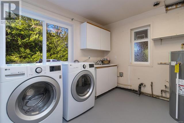 Laundry room with hot water heater recently installed (2024) | Image 33