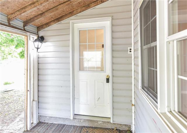 Front door off of covered porch | Image 10