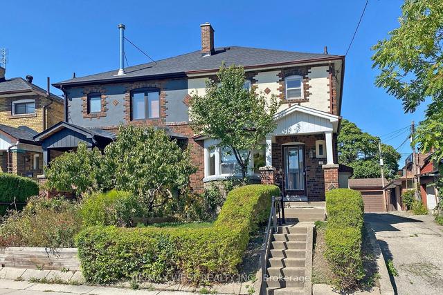 12 Dewson St, House semidetached with 3 bedrooms, 2 bathrooms and 1 parking in Toronto ON | Image 1