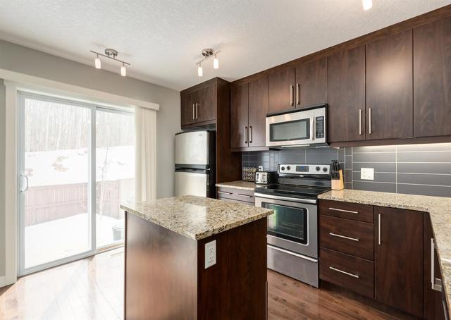 35 Aspen Hills Drive Sw, Home with 3 bedrooms, 3 bathrooms and 1 parking in Calgary AB | Image 4