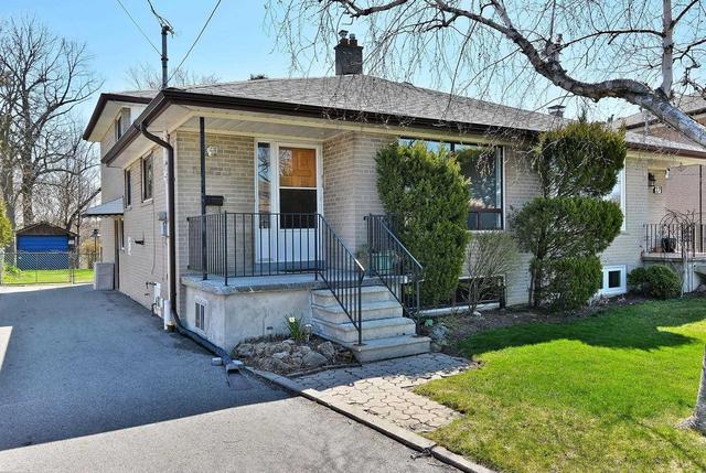 29 Newlin Cres, House semidetached with 4 bedrooms, 2 bathrooms and 3 parking in Toronto ON | Image 1