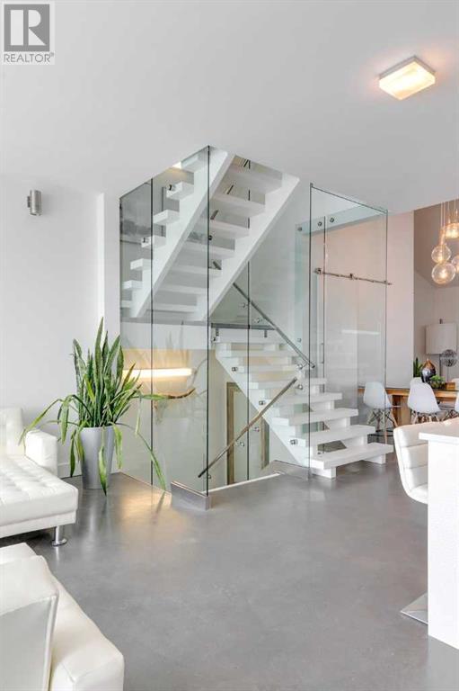 Ascend the main staircase to the primary suite.. | Image 19