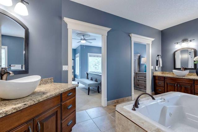 72 Discovery Valley Cove Sw, Home with 5 bedrooms, 5 bathrooms and 4 parking in Calgary AB | Image 31