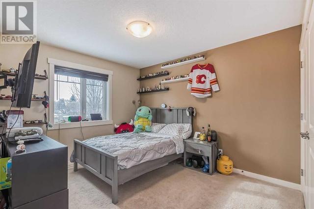 128 Mike Ralph Way Sw, House detached with 4 bedrooms, 3 bathrooms and 2 parking in Calgary AB | Image 32