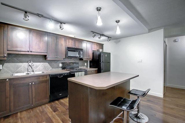 102 - 1025 14 Ave Sw, Condo with 2 bedrooms, 1 bathrooms and 1 parking in Calgary AB | Image 1