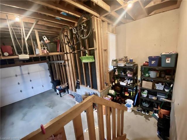 The garage has a storage nook and storage in the rafters | Image 32