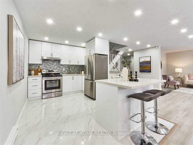 1102 - 100 Mornelle Crt, Townhouse with 5 bedrooms, 3 bathrooms and 2 parking in Toronto ON | Image 2