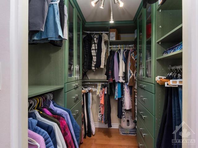 Walk-in closet with custom shelving and drawers, hardwood flooring! | Image 18