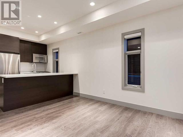 101, - 1707 27 Avenue Sw, Condo with 1 bedrooms, 1 bathrooms and 1 parking in Calgary AB | Image 10
