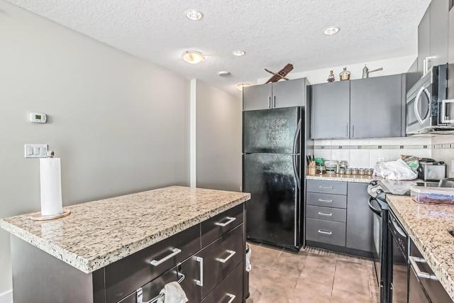 2203 - 77 Spruce Place Sw, Condo with 2 bedrooms, 2 bathrooms and 1 parking in Calgary AB | Image 3